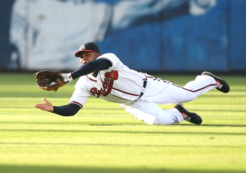 Which Curaçaoan infielder won five Gold Gloves in Major League Baseball?