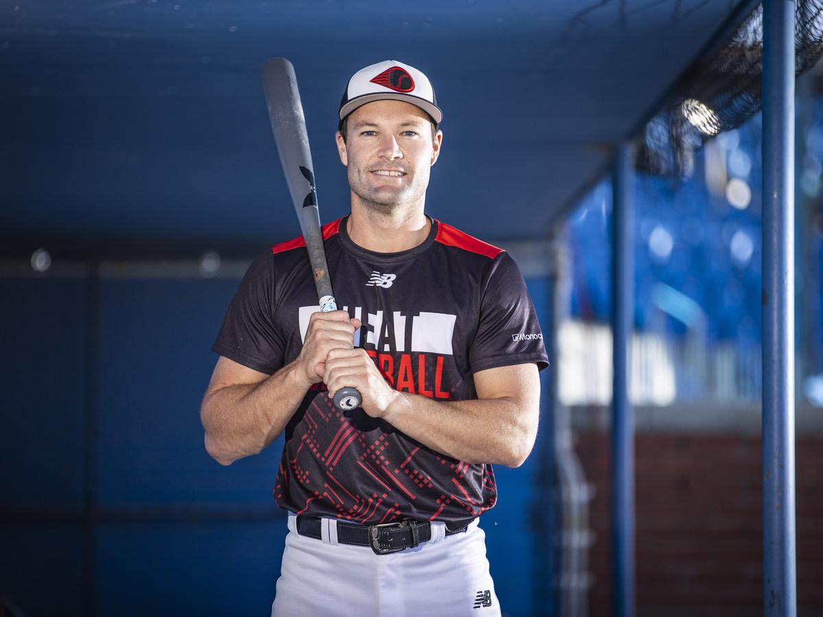 Australian Baseball League legend Tim Kennelly holding a bat at the ballpark