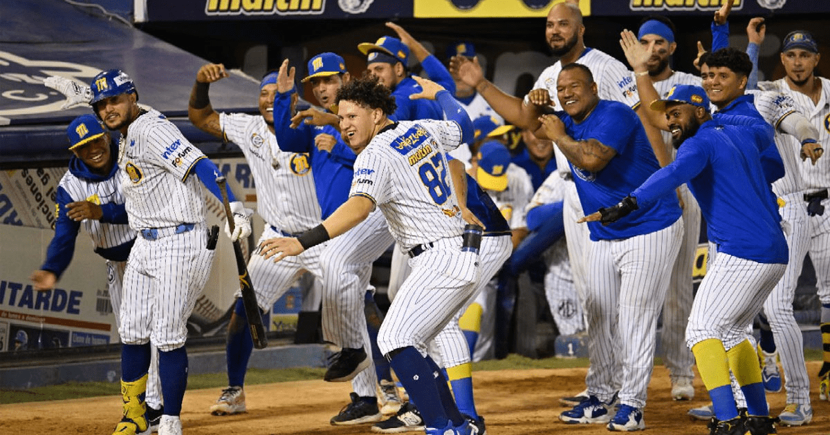 Players of Navegantes del Magallanes celebrate on the field after clinching the LVBP championship in the Venezuelan Winter League.
