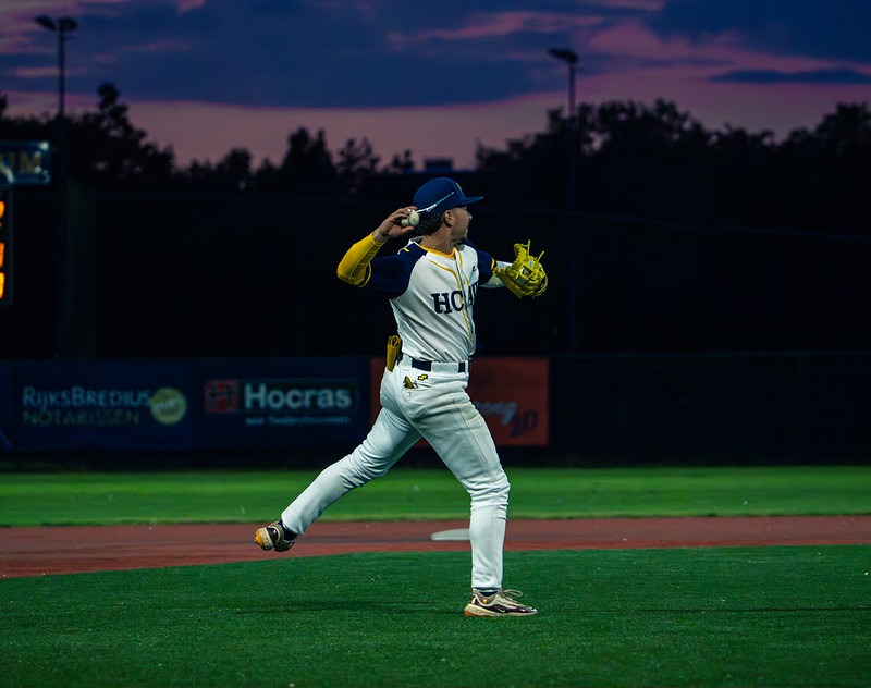 HCAW pitcher delivers a throw during an evening game against the Oosterhout Twins in the Dutch Honkbal Hoofdklasse