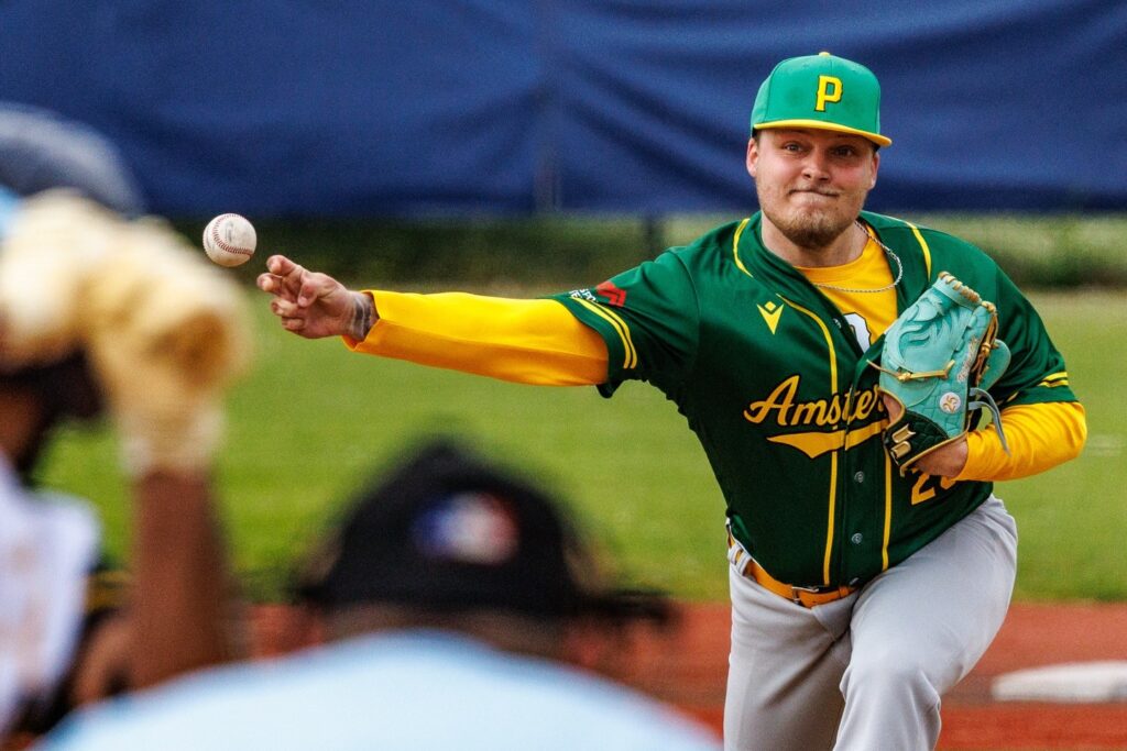 Amsterdam Pirates pitcher Pim Vijfvinkel delivers a pitch during a dominant shutout performance against UVV in the Dutch Honkbal Hoofdklasse.