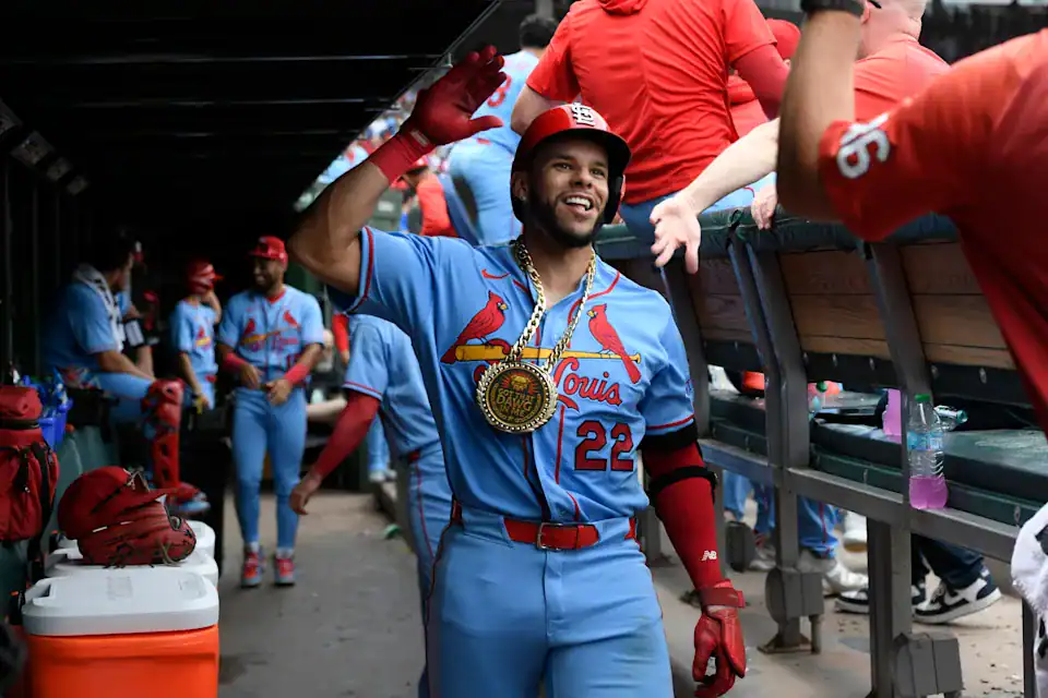 Joshua Báez Celebrates MLB Milestone Joshua Báez in Cardinals uniform celebrating in dugout after game.