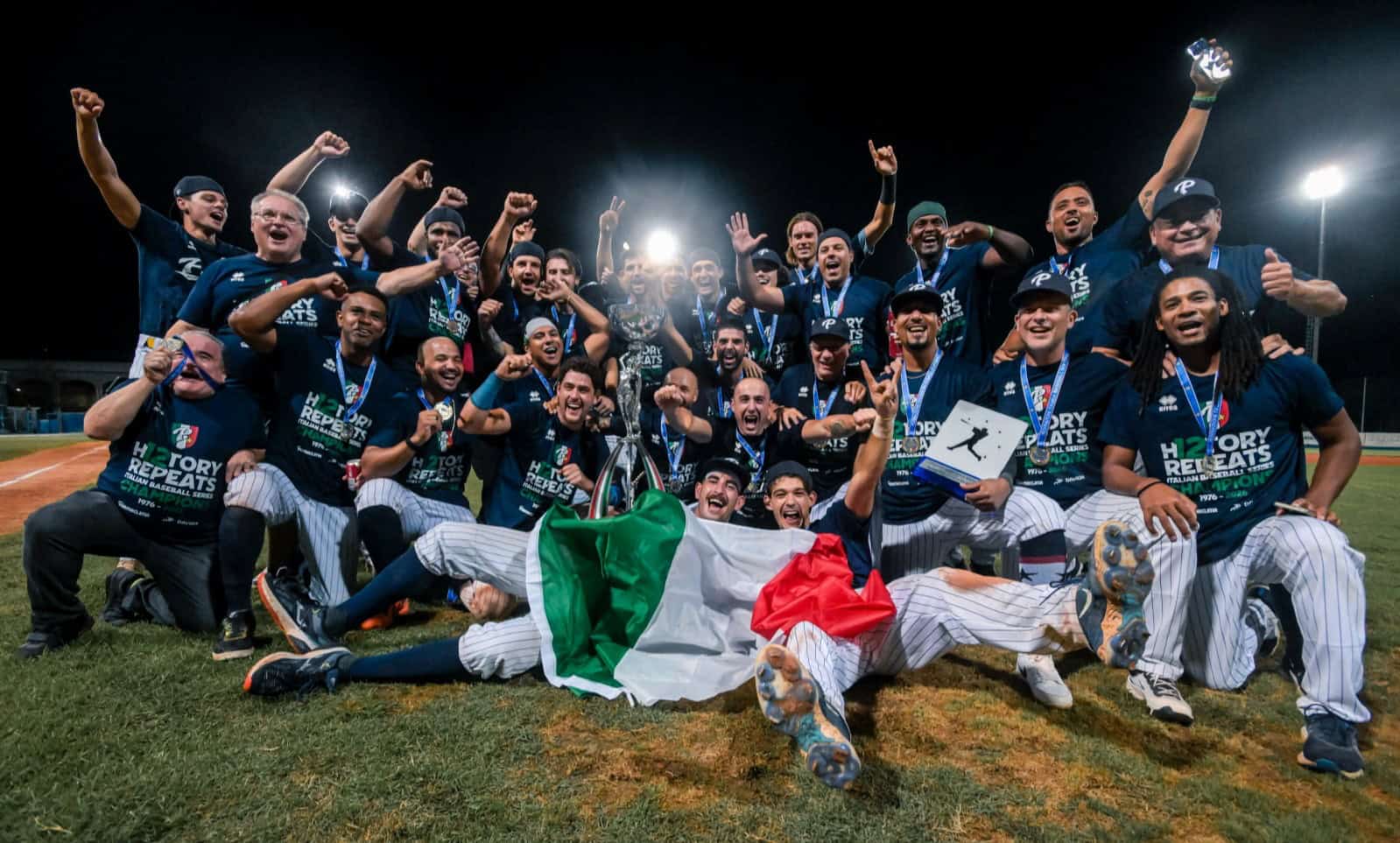 Parma Clima celebrates winning the 2026 Serie A Baseball championship with the trophy and Italian flag