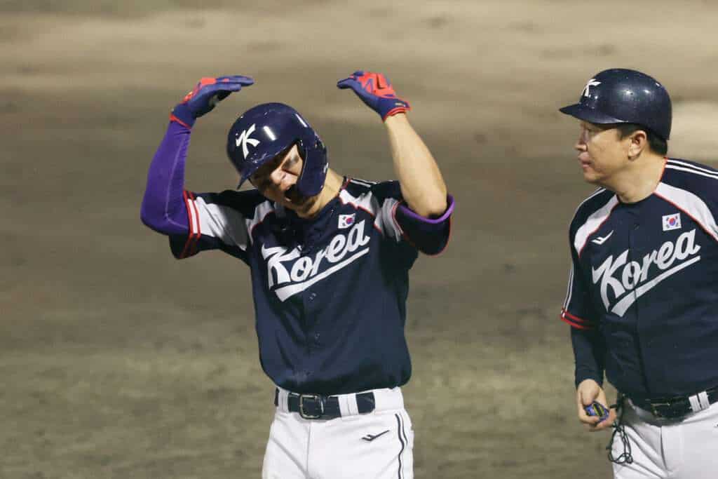 South Korea's Kim Do-yeong celebrates his go-ahead hit against Japan in the 2026 Asian Games baseball final