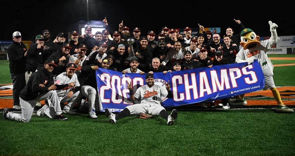 Long Island Ducks players celebrate with the Atlantic League championship trophy after winning the 2026 title