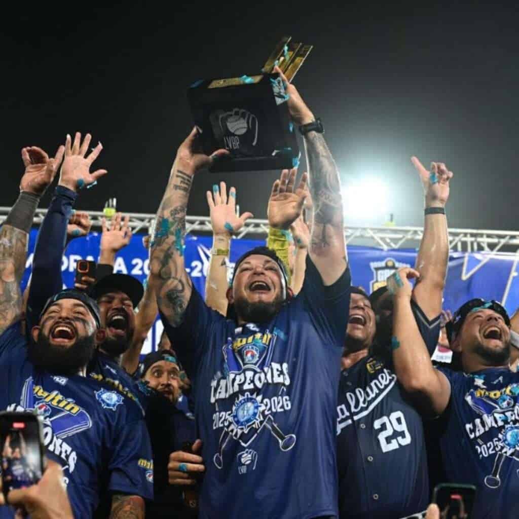 Navegantes del Magallanes players celebrate the 2025-26 LVBP championship with the trophy