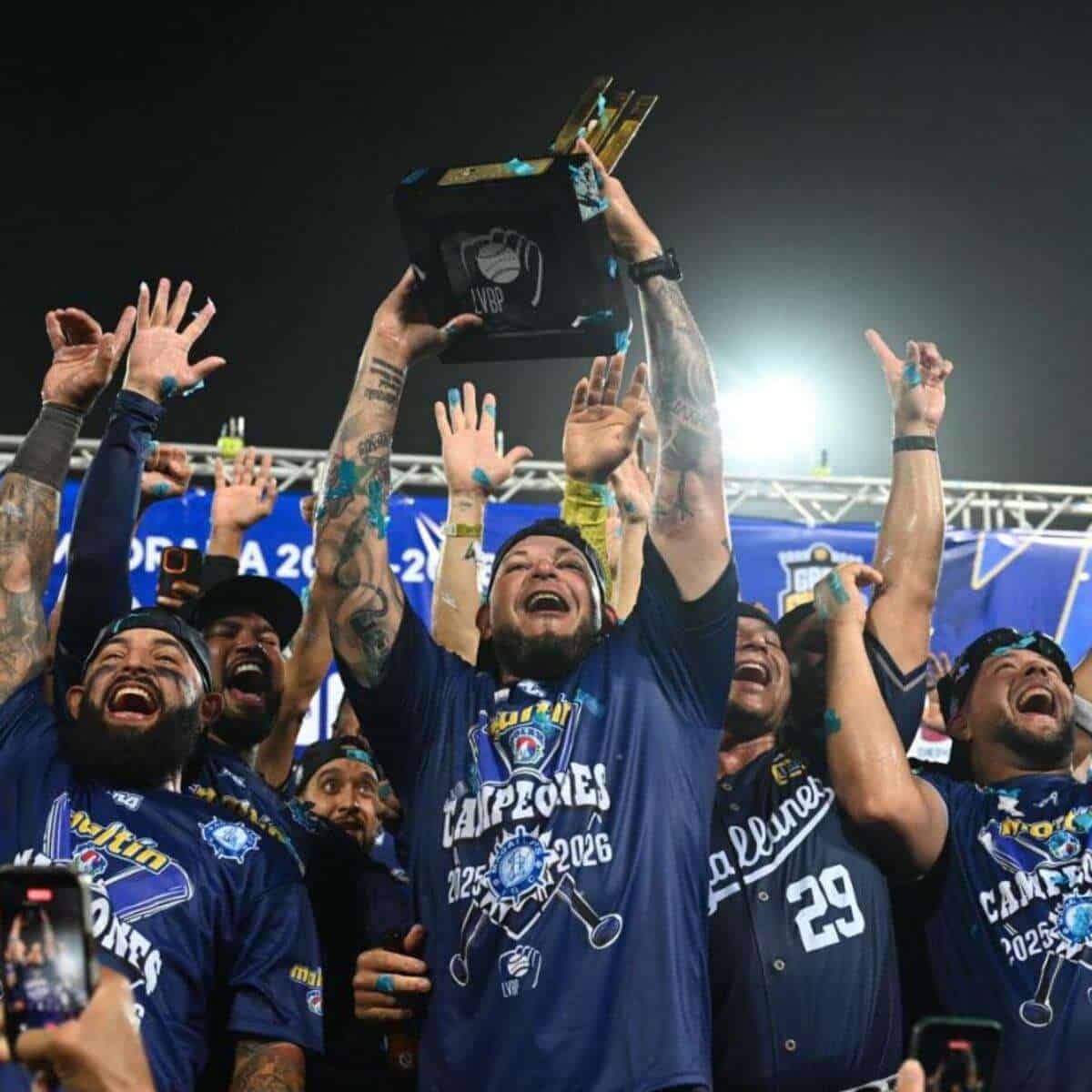 Navegantes del Magallanes players celebrate the 2025-26 LVBP championship with the trophy