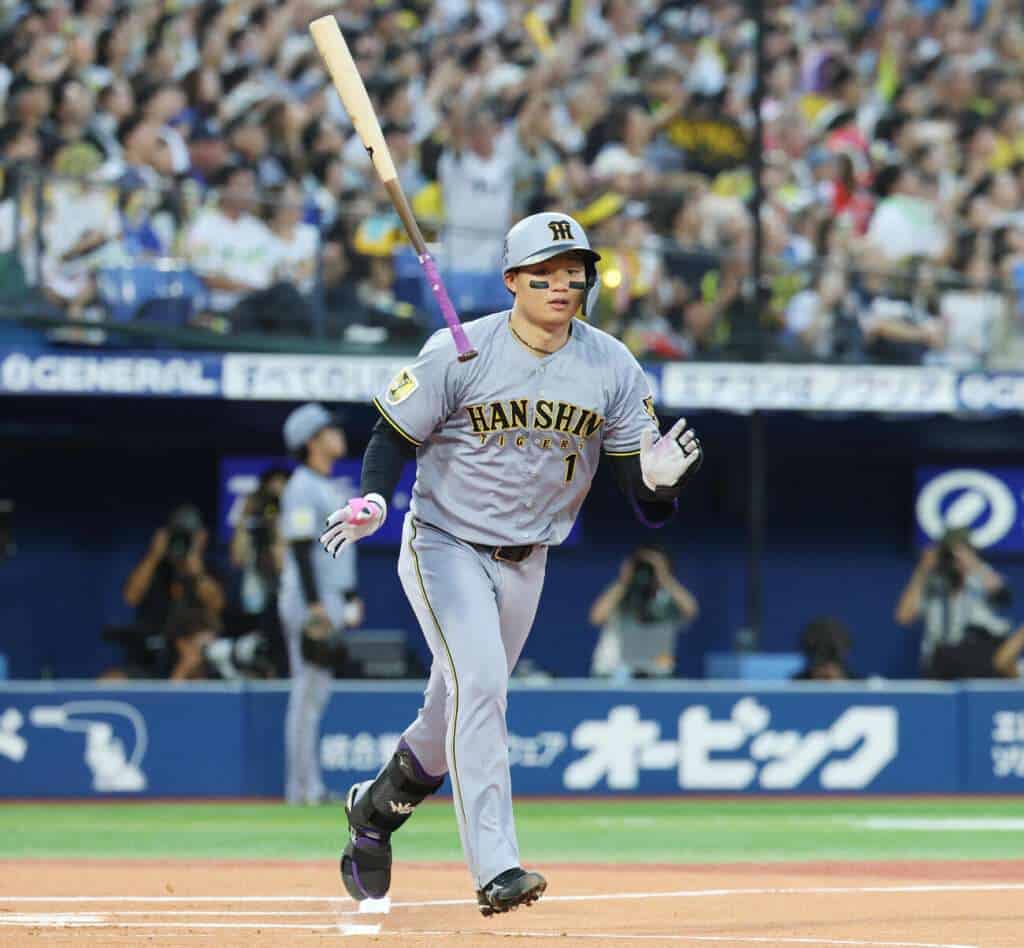 Shota Morishita of the Hanshin Tigers runs after hitting during a 2026 NPB game against the Yokohama DeNA BayStars