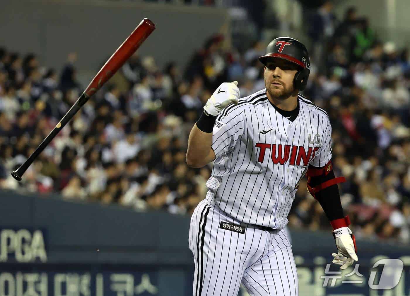 LG Twins hitter Austin Dean flips his bat after a two-run home run against the Doosan Bears in the 2026 KBO Wild Card game