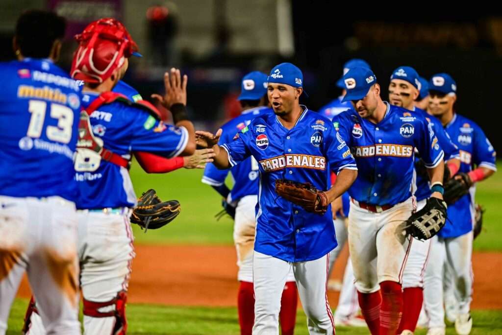 Cardenales de Lara players in blue uniforms celebrate on the field during the 2026–27 LVBP season