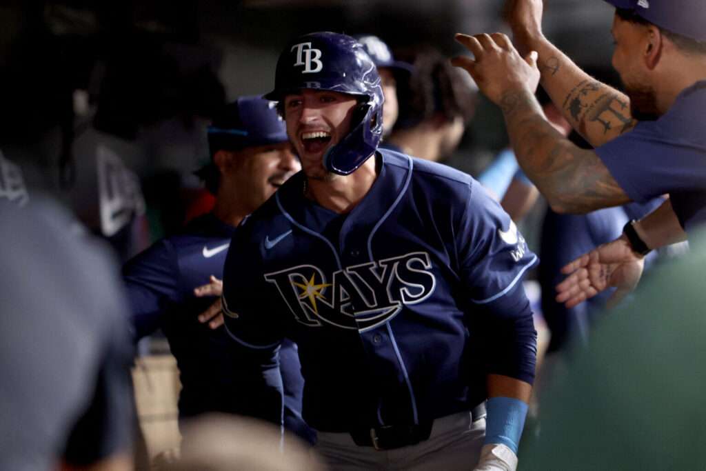 Carson Williams celebrates in the Tampa Bay Rays dugout after an August 2026 home run against the Athletics