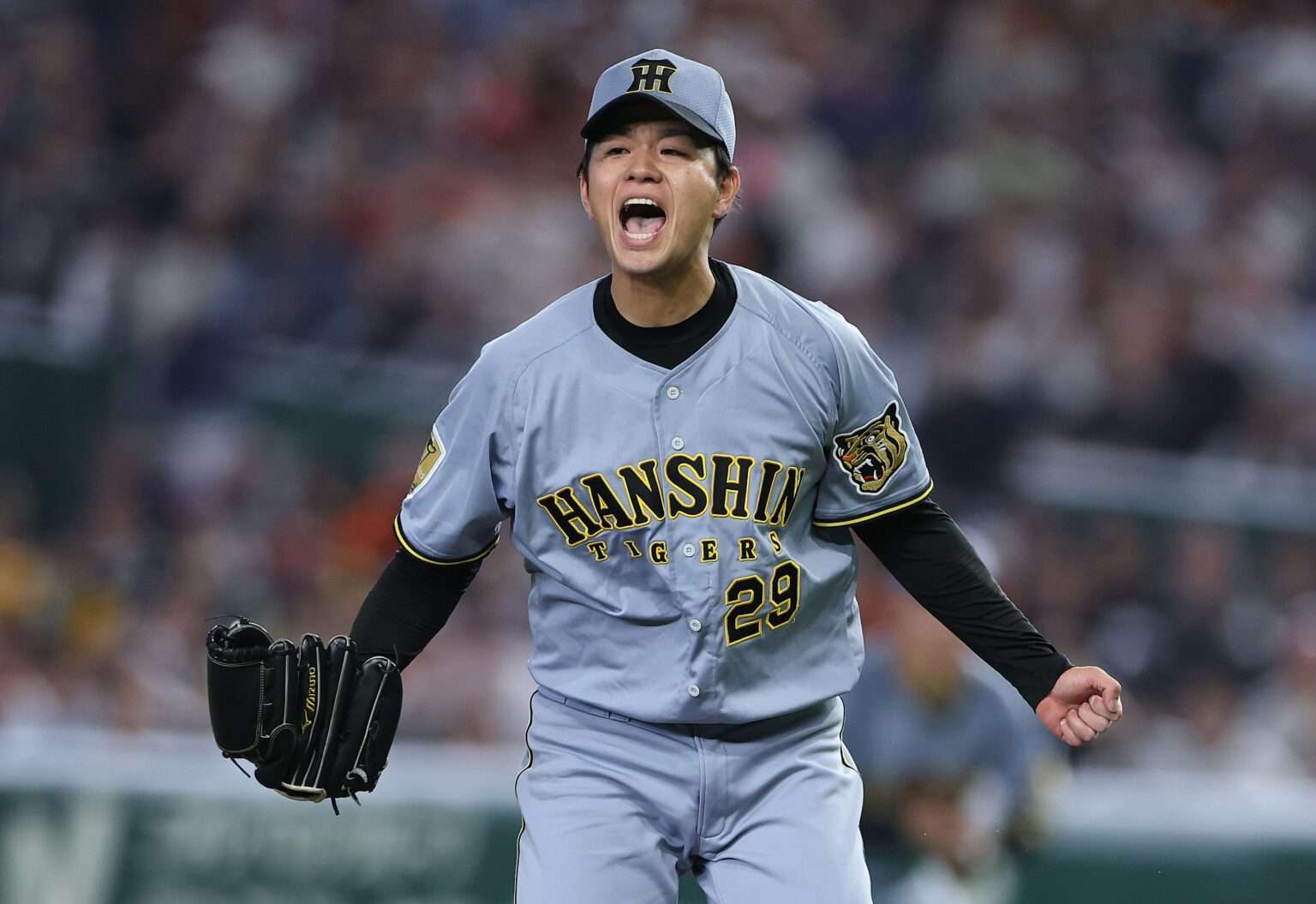 Hanshin Tigers pitcher Haruto Takahashi celebrates a complete-game shutout during the 2026 NPB season