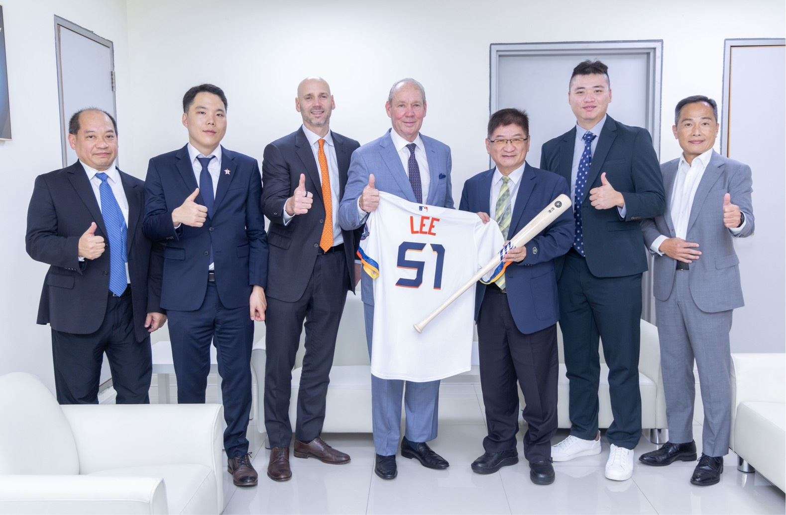 Houston Astros chairman Jim Crane and pitcher Kai-Wei Teng pose with Taiwanese officials at the October 20, 2026 baseball partnership ceremony