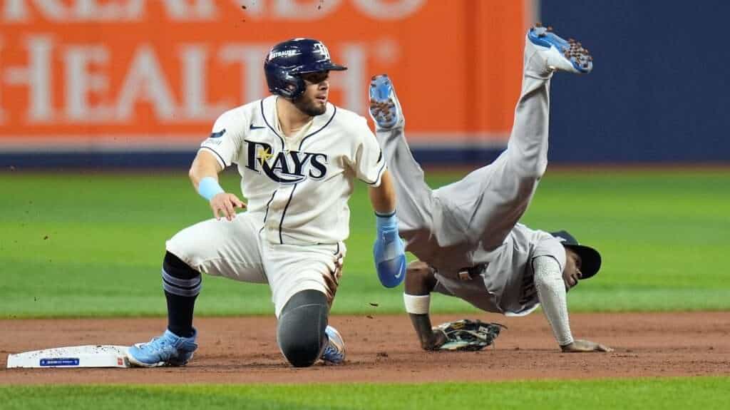 Jazz Chisholm Jr. flips over Jonathan Aranda while making a throwing error in Yankees-Rays ALDS Game 2