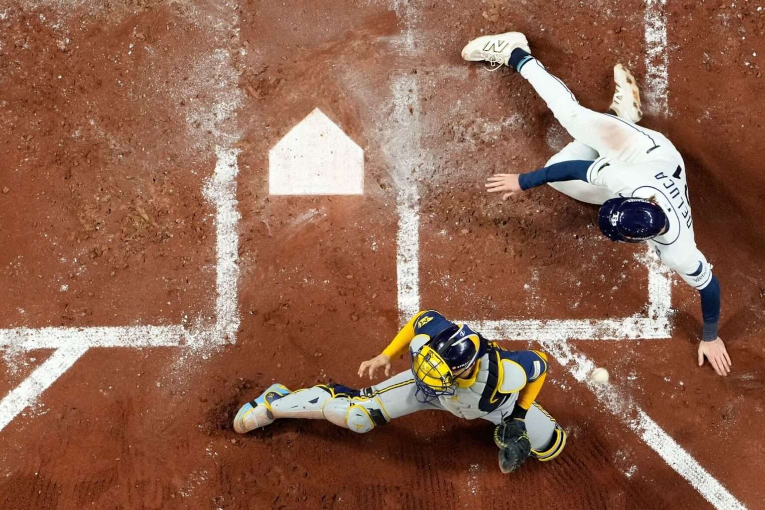 Tampa Bay Rays outfielder Jonny DeLuca scores against the Milwaukee Brewers in Game 4 of the 2026 World Series