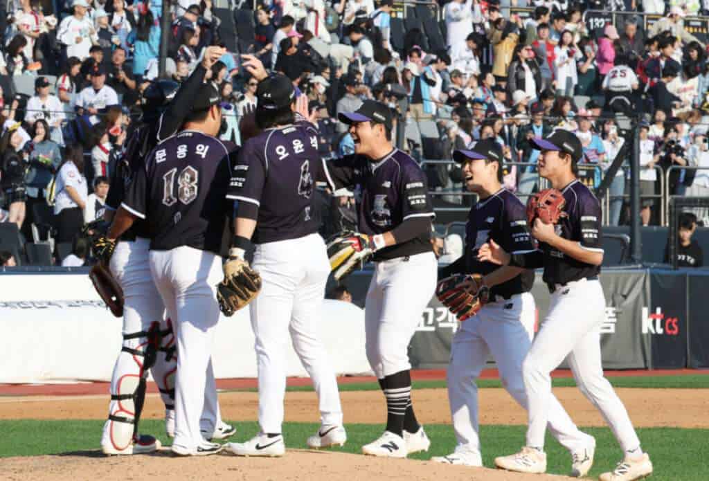KT Wiz players celebrate clinching the 2026 KBO regular-season championship after beating the Lotte Giants in Suwon