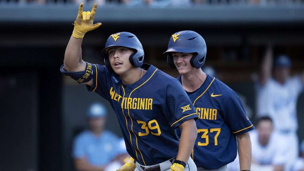 Kyle West of West Virginia signals toward the dugout during the 2024 NCAA Super Regional against North Carolina