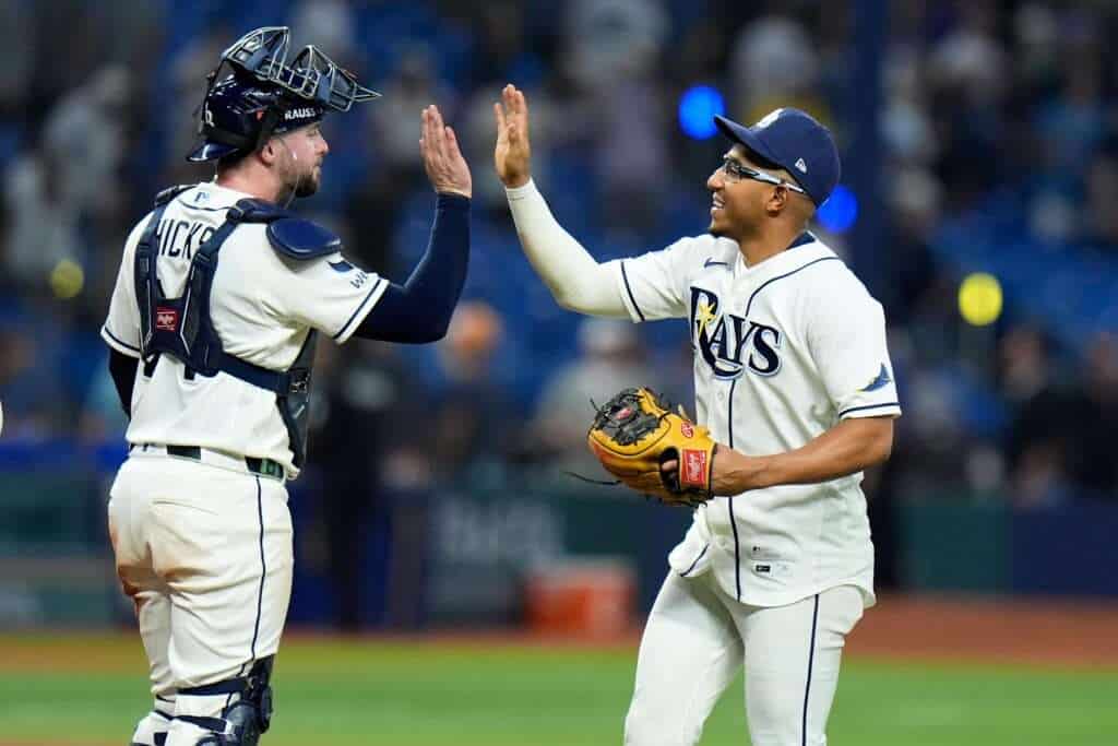Tampa Bay Rays catcher Liam Hicks celebrates a postseason victory with teammate Richie Palacios