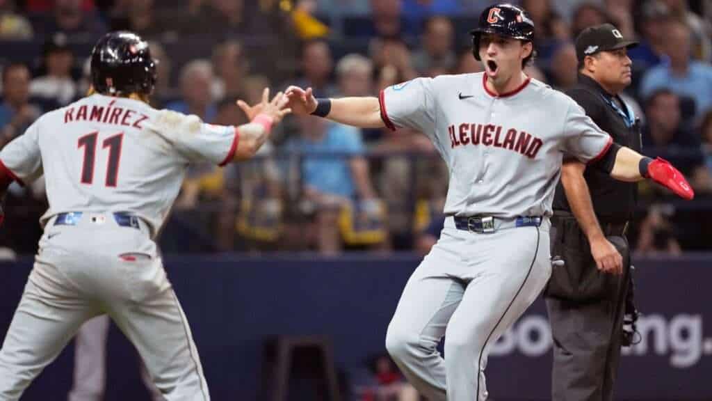 Nathaniel Lowe celebrates with José Ramírez after his go-ahead two-run single for the Cleveland Guardians in ALCS Game 1