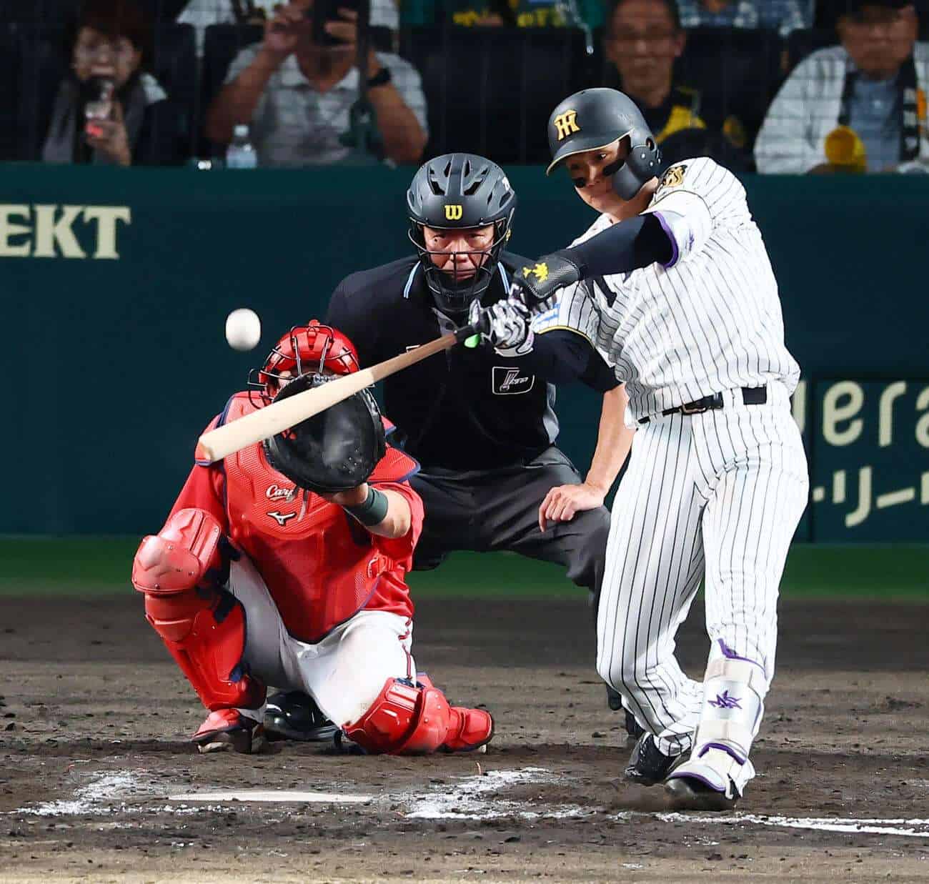 Hanshin Tigers outfielder Shota Morishita bats against the Hiroshima Carp during the 2026 NPB season
