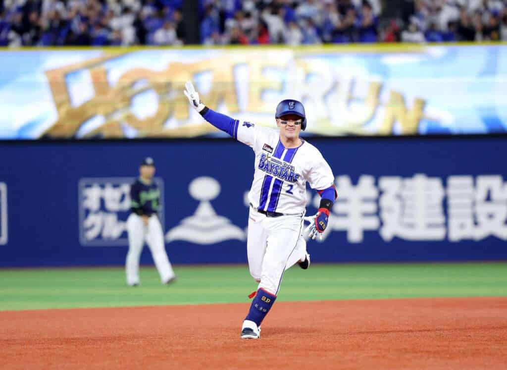 Shugo Maki celebrates after hitting a home run for the Yokohama DeNA BayStars