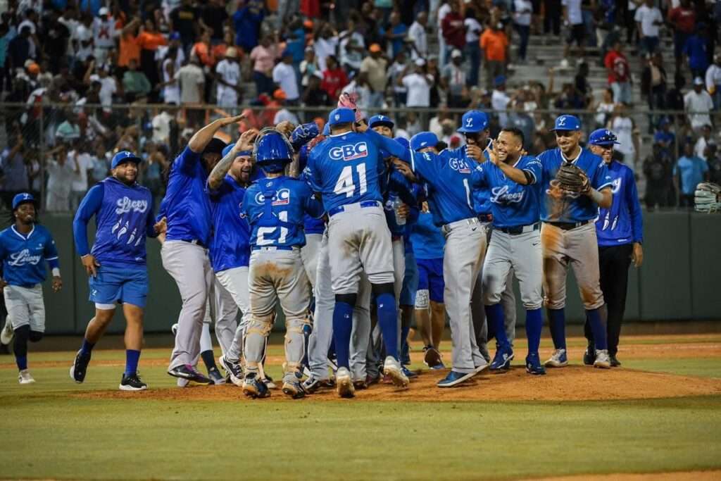 Tigres del Licey players and staff celebrate their combined no-hitter against the Toros del Este at Estadio Francisco Micheli