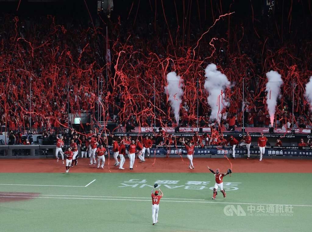 Wei Chuan Dragons players celebrate their 2026 Taiwan Series championship under red streamers at Taipei Dome