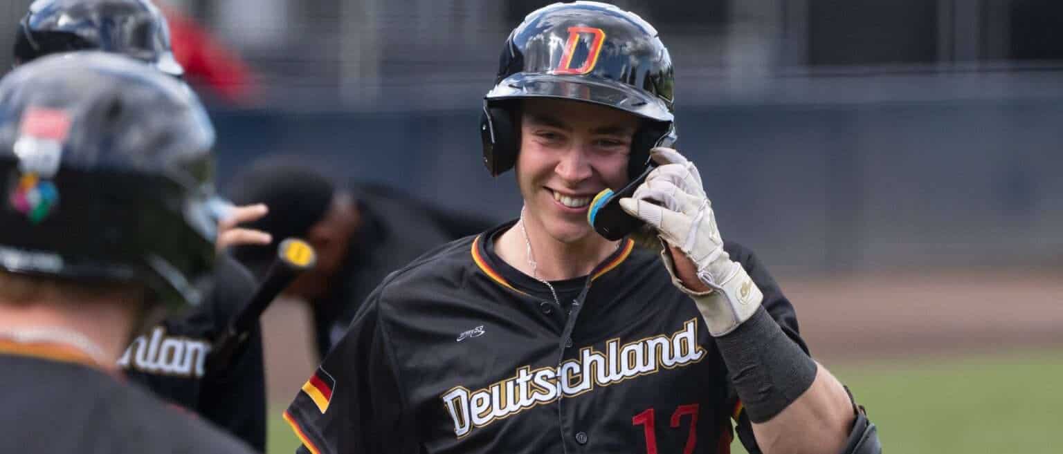 Yannic Walther celebrates in Germany’s national baseball team uniform during a game against Spain